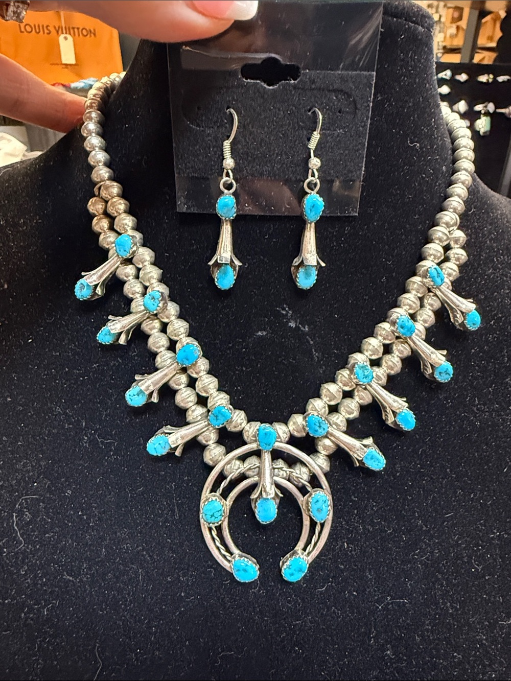 524238 Silver woman’s Navajo Squash Blossom necklace and earring set.
